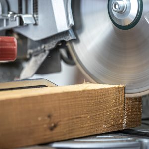 Circular saw miter saw photographed in the workshop atmosphere.